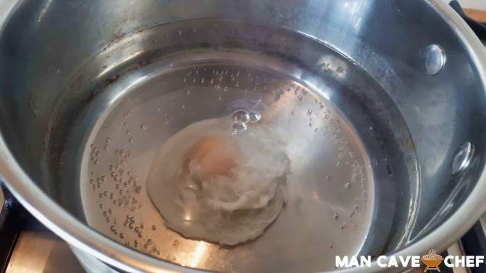 Poached egg cooking in water